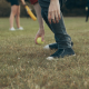 selective focus photography of man holding green baseball